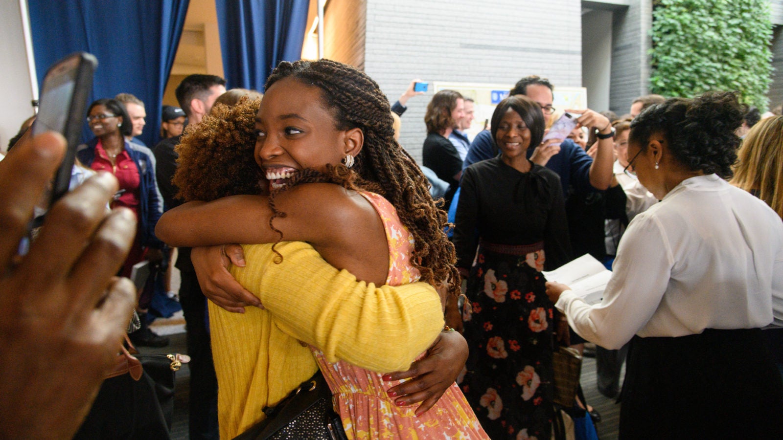 A Center for Human Rights & Social Justice student hugs her family on Match Day.