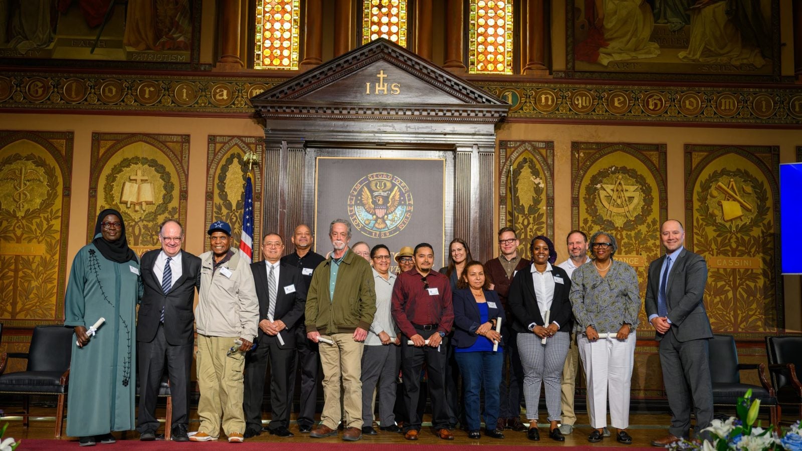 President John J. DeGioia stands with the honorees at the Service Awards Ceremony.