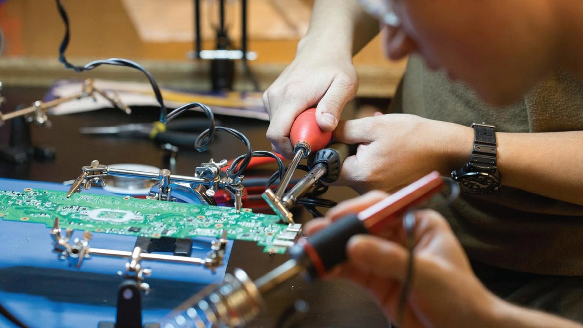 Students use equipment in the Maker Hub