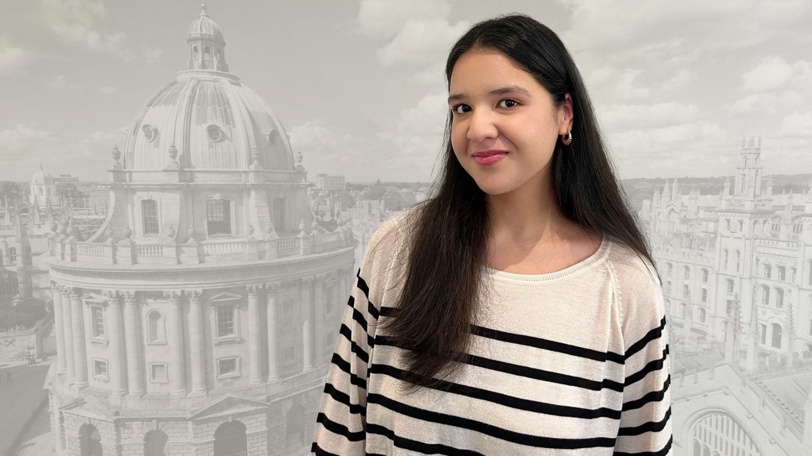 A headshot of Asma Shakeel, a 2024 Rhodes winner, superimposed over a faded background of a building at the Academy of Oxford.